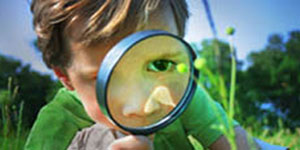 Boy with Magnifying glass