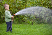 Boy Watering Grass